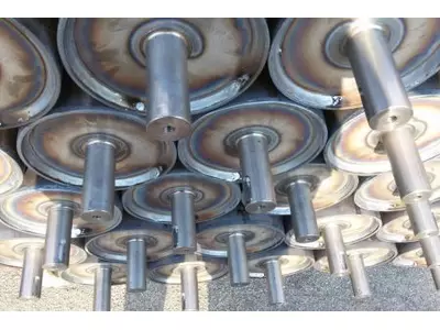 Rulli saldati a disegno con eventuale gommatura.jpg